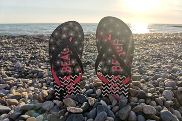 beach slippers on the pebble beach