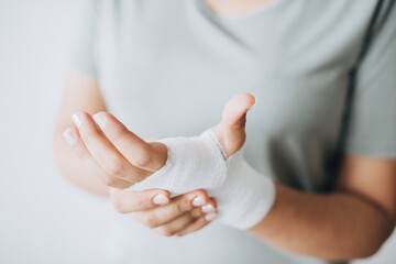 Woman with gauze bandage wrapped around her hand