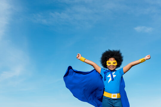 Girl with afro playing superhero