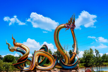 Fototapeta premium Twin Stucco painted as a large serpent at Pra kai keaw wang nakin, Located at Ban Don swan, Phen District, Udon Thani, Thailand.