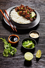 Cauliflower wings with rice on a bowl, close-up