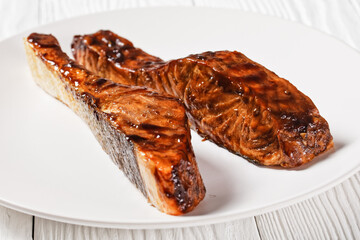 Salmon teriyaki fillet on a white plate