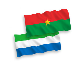 National vector fabric wave flags of Burkina Faso and Sierra Leone isolated on white background. 1 to 2 proportion.