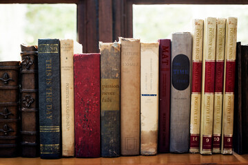 Old books arranged on the shelf - Powered by Adobe