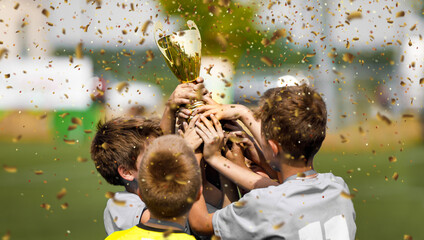 Happy Football Team Rising Golden Trophy on Confetti Celebration Moment. Happy Kids Winning Soccer...