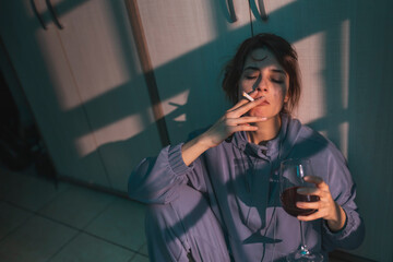 Woman smoking and drinking wine