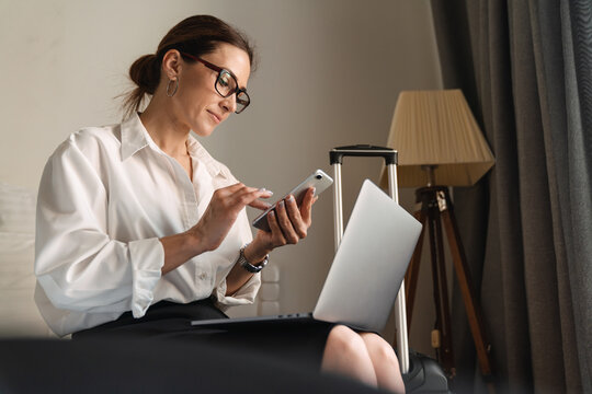 Smiling mid aged brunette white businesswoman