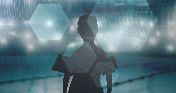 Hexagonal shapes and lines against silhouette of boy with inflatable armbands against swimming pool