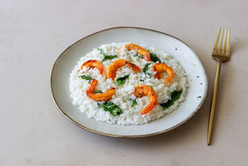 Risotto with shrimps and spinach. Healthy food. Vegetarian food.