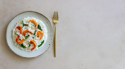 Risotto with shrimps and spinach. Healthy food. Vegetarian food.