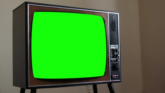 Old retro analog TV with blank green screen
