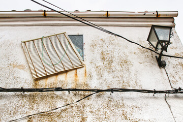 Old facade and streetlight in a village in Castilla La Mancha, Spainh