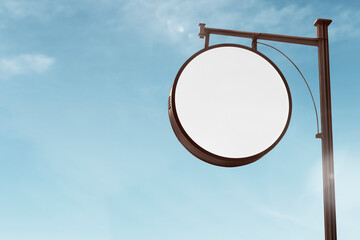 Round classic sign post in the blue sky