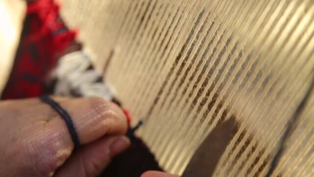 Traditional handcrafted carpet weaving.
