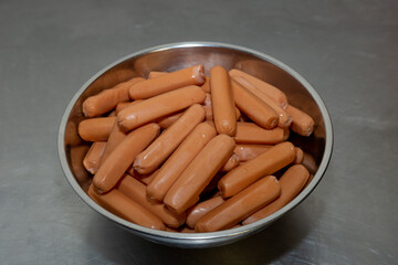 Hot dogs or sausages in a plate on the table