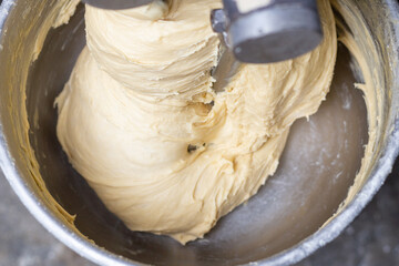 Mix the dough in a kneading machine.
