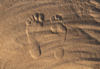 Sand background on beach and footprints
