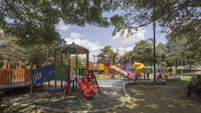timelapse of colorful playground on yard in the park