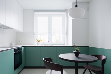 Modern kitchen with dining table