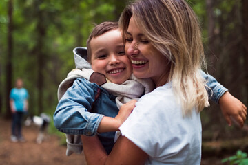 Obraz na płótnie Canvas happy loving son and mother, family lifestyle outdoor portrait