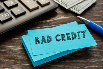 Financial concept meaning BAD CREDIT with sign on the page.