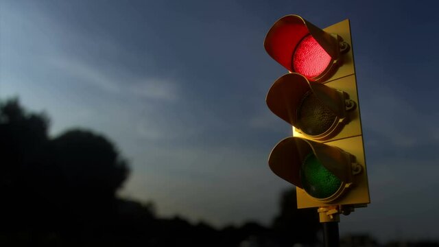 Outdoor vertical traffic light. Traffic control concept image with shallow depth of field.