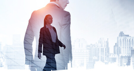 Silhouettes of two professional business people rushing and looking for solutions in abstract office with New York skyscrapers city view at sunset. Business development concept. Double exposure