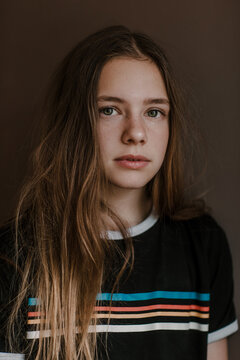 Teenage girl looking at camera in studio