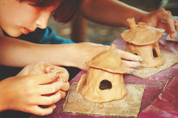 Having fun with colorful modeling clay. Creative kids molding at home.
