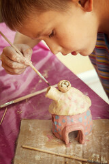 Having fun with colorful modeling clay. Creative kids molding at home.