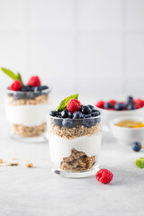 Granola with yogurt, blueberries and raspberries. Healthy breakfast. Menu, recipe.
