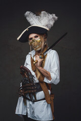 Woman pirate with golden mask and saber