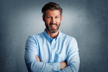 Confident and happy man standing at isolated background