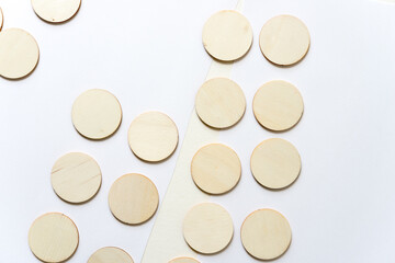 round wooden shapes on paper