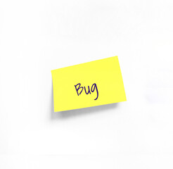 Isolated Yellow sticker with Bug Handwriting text on white Whatman paper. Concept programming, testing, business. Handwriting text, copy space