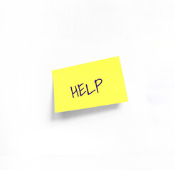 Isolated Yellow sticker with HELP Handwriting text on white Whatman paper. Concept programming, testing, business. Handwriting text, copy space