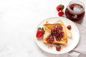 Toasted bread slices with strawberry jam