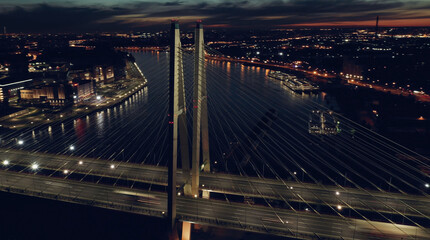 Obraz na płótnie Canvas Aerial top view of bridge road automobile traffic of many cars, transportation concept