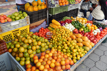 Fototapeta na wymiar Fruits and vegetables displayed for sale at the market in Otavalo, Ecuador.