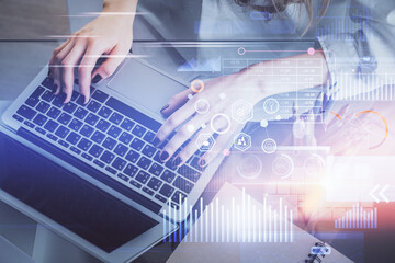 Double exposure of woman hands working on computer and data theme hologram drawing. Tech concept. © peshkova