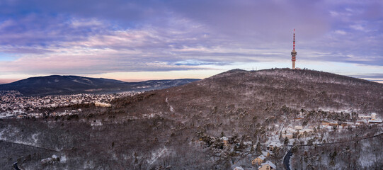 Aerial view of a snowy mountain with a TV tower, P&eacute;cs, Hungary