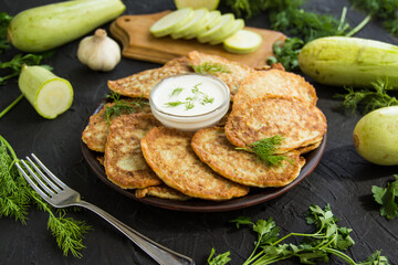 A healthy breakfast of zucchini pancakes. Creative atmospheric decoration