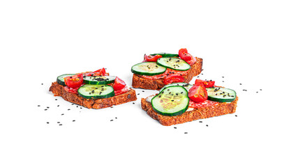Bruschetta with cream cheese, sausage and vegetables isolated on a white background. Rye bread toast. Sausage sandwich. Sandwich with vegetables and cheese.