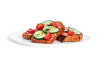 Bruschetta with cream cheese, sausage and vegetables isolated on a white background. Rye bread toast. Sausage sandwich. Sandwich with vegetables and cheese.