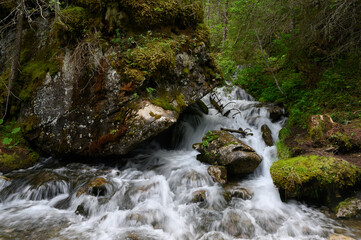 mountain creek at idyllic Lake Lauenensee in spring, Bernese Alps, Switzerland