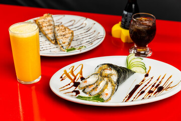 Delicious Sushi Temaki Hot Fried Tuna Salmon Fish Dish On a Red Table