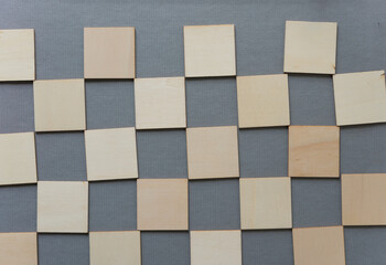wooden shapes on medium grey background