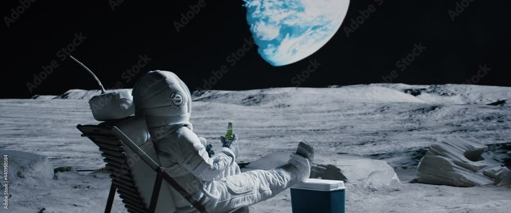 Canvas Prints crane back view of lunar astronaut having a beer while resting in a beach chair on moon surface, enj