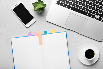 Composition with bookmarks and modern gadgets on light background