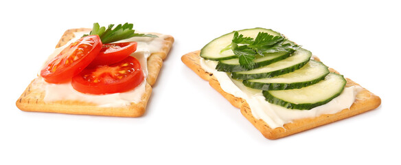 Tasty crackers with cheese, tomatoes and cucumber on white background
